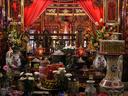 A very cluttered (but neat) temple altar.